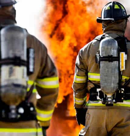 Image of firefighters watching a fire.