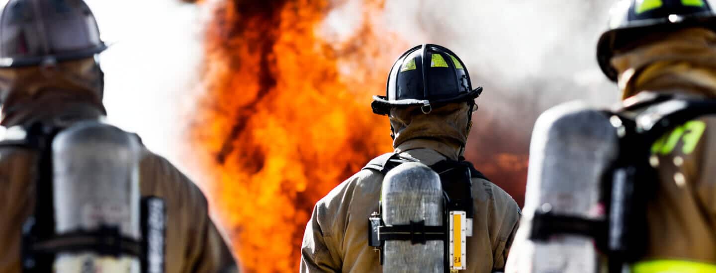 Image of firefighters watching a fire.